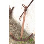 A large cast iron anchor, height 132cm, width 124cm.