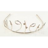 A contemporary Scottish silver tiara with applied silver flowerheads each has a gold stamen,