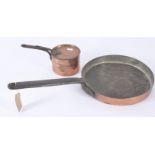 Two copper pans, each with cast iron handle, length of largest 56.5cm, diameter 28.2cm.