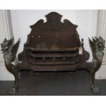 A Victorian brass and cast iron fire grate basket, flanked by models of griffins, height 63cm,