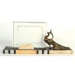 An Art Deco marble photo frame holder, with a figure of a peacock, height 21.
