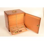 A Victorian pine cabinet, containing approximately two hundred and fifty assorted microscope slides,