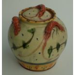 A pottery glazed jar and cover, applied with lobsters, height 22cm.
