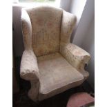 Two George III style mahogany upholstered wing armchairs,
