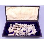 An alabaster chess set, complete, height of kings 6.3cm, in a leather box.
