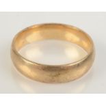 A 9ct gold band, size X, 6.4g.