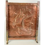 A Hayle copper firescreen, embossed decoration of a galleon at sea, with brass splay feet,
