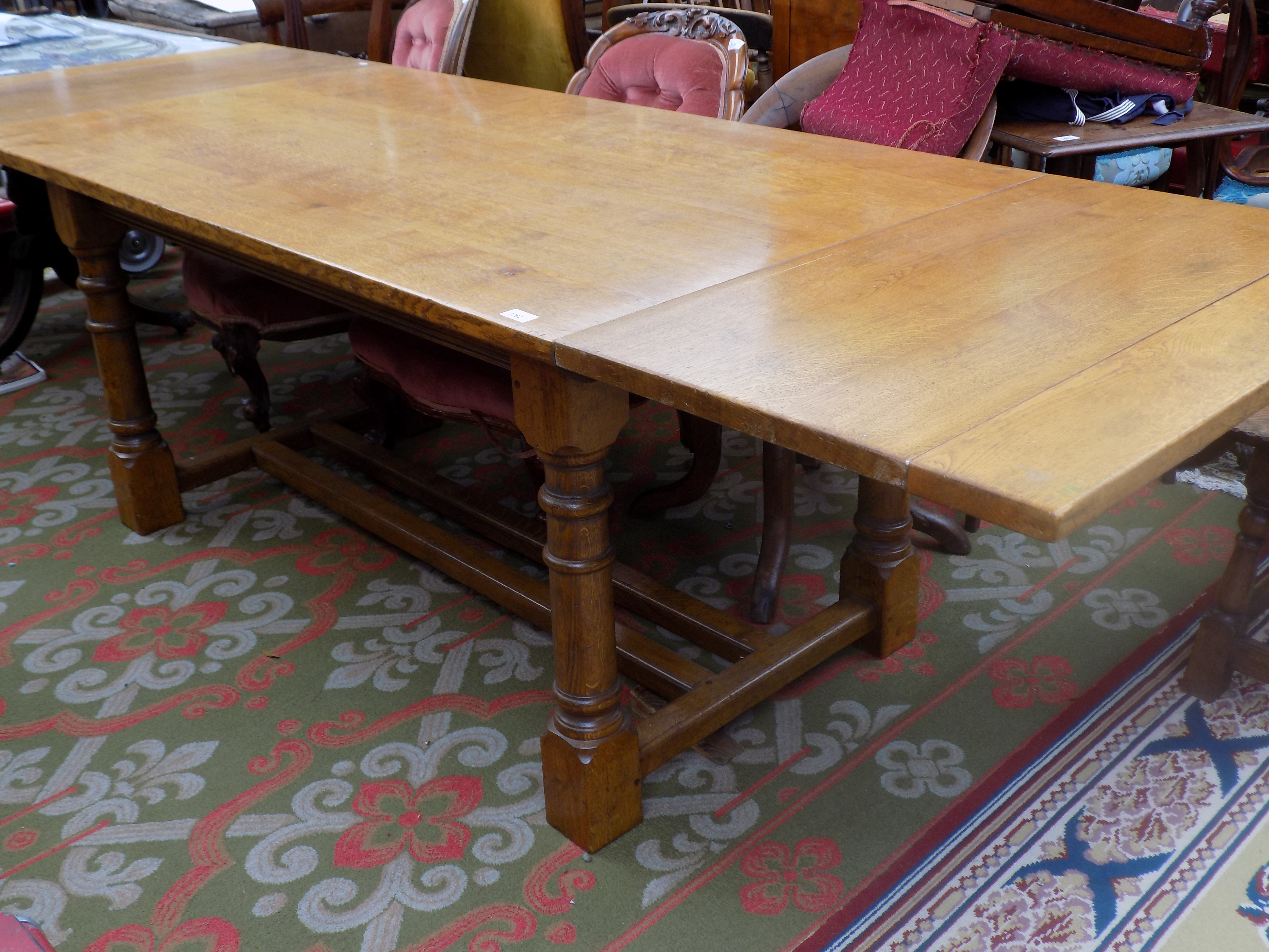 An oak draw leaf refectory table, 20th century, height 76cm, length fully extended 265cm,