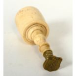 A Victorian ivory and gilt metal seal, height 7.2cm, diameter 2.5cm.