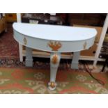 A blue and gilt painted demi lune washstand, with a central sabre leg, height 64cm, width 104cm,