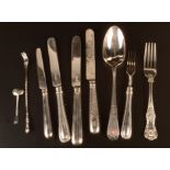 Four silver bladed knives each with filled silver handles, a George III bright cut tablespoon,