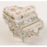 A Dresden style porcelain flower encrusted box, in the form of a grand piano, width 11 cm.
