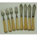 An Edwardian set of four silver fish knives and forks with bone handles, London 1907.