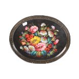 A tole peinte oval tray, painted with flowers and signed M.Ciuiceh?, 40.5 x 50.5cm.
