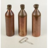 Three black gunpowder copper flasks, two with 'ICI' engravings to the bottom, one from South Basset,
