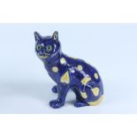 A Mosanic blue pottery cat, with glass eyes, inscribed 'Mosanic 8', height 21cm.