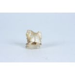 A mother of pearl Pekingese dog, height 2.4cm.