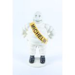 A cast iron figure of Michelin man, 20th century, height 37cm, width 23cm.