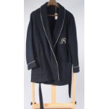 A Selfridges, navy wool smoking jacket with white cord piping and monogrammed with an 'R',