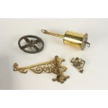 A Salters brass clockwork spit, with wall bracket.