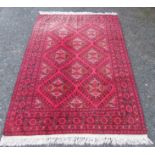 An Afghan carpet,