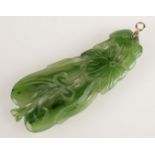 A Chinese jade pendant with gold bail.
