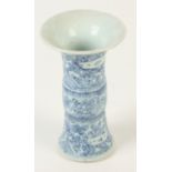 A Chinese blue and white porcelain Gu vase, decorated with figures seated around tables,
