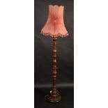 A mahogany standard lamp.