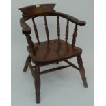 An elm and beech captain's armchair, circa 1900,