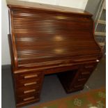 A walnut roll top desk, width 124cm, height 127cm, depth 85cm.