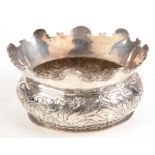 An oval sectioned Montieth bowl with embossed decoration in late 17th century style.