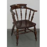 An elm and beech captain's armchair, circa 1900,