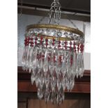 A cut glass and gilt metal hanging waterfall ceiling shade, with red and clear glass drops,