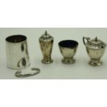 A set of three silver condiments, Chester 1936, together with a silver mug, 6.1oz.
