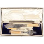 A pair of ornate fish knives and forks cased and a pickle fork.