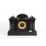 A French black marble cased architectural mantle clock.
