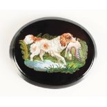 A Roman micromosaic oval panel, showing a wading spaniel with a mallard in its mouth, 50 x 41mm,