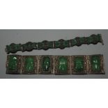 A Chinese filigree bracelet set with simulated jade panels and one other bracelet.