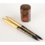 Chanel No 5 perfume writing pens in presentation case by Arpege and a tartan box.
