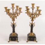 A pair of gilt metal, black slate and onyx, five branch candelabras, height 43.