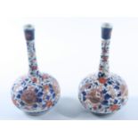 A pair of Japanese porcelain bud vases, early 20th century, height 18.8cm.