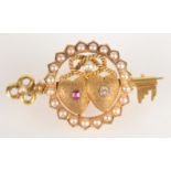 A good Victorian 18ct gold brooch at the centre conjoined hearts one set a diamond the other a ruby