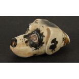 A porcelain whistle in the form of a dog's head, 19th century, height 2.2cm, length 4.5cm, width 2.