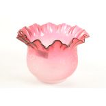 A Victorian cranberry glass oil lamp shade, height 15cm, diameter 21.5cm.