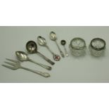An Art Nouveau bull-nosed silver serving fork, various silver spoons, 4.