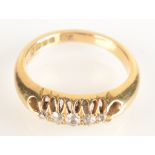 A heavy 18ct gold ring, claw set with five diamonds, 6.2g.