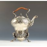 An ornate rococo silver spirit kettle with floral and acanthus repousse decoration,