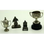 Two miniature trophies, a miniature silver throne, and a silver coloured metal figure, 104g.