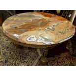 A Maison Jansen onyx and gilt metal circular table, height 42cm, diameter 77cm.