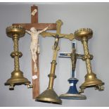 A pair of brass altar candlesticks, circa 1900, height 31cm, a brass crucifix, height 46.